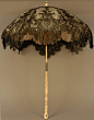 Folding chantilly lace parasol with carved ivory handle, 1870’s    Beautiful!
