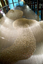 THOMAS HEATHERWICK, BLEIGIESSEN: 30 meter tall installation using 142,000 glass spheres suspended on 27,000 high tensile steel wires.: 