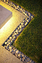 Pebbles and exposed aggregate concrete (less maintenance than pebbles)