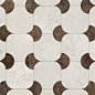 This may contain: a white and brown tiled floor with circles on the top, in an irregular pattern
