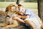 Boy hugging dog on wooded beach by Gable Denims on 500px