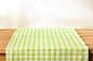 Photo green cloth napkin on wooden background