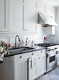 Subway tile and square tile backsplash above stove: 