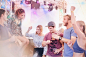 Young friends dancing at music festival by Caia Images on 500px