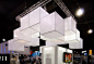 Ingenious - Hanging Cubes  These 4x4 cubes were skinned in celtic and sheer materials. The celtic cubes used T5 fluorescent lights for a soft even glow, and added visual interest above the 20x20 space. The cubes were attached to each other which eliminate