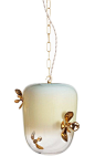 The GIA LANTERN is made of hand blown glass adorned with handcast porcelain succulent blooms. Design by Avram Rusu | DSHOP  http://shop.thedpages.com/products/gia-lantern-pendant-light-1: 