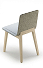 Thin backrest, seating and backrest combined and covered in textile.