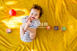 人,玩具,2到5个月,文字,室内_557473475_Caucasian baby girl playing with blocks on bed_创意图片_Getty Images China