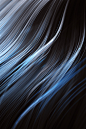 a black and blue background with white streaks