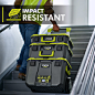 This may contain: a man in safety vest walking down an escalator with three tool boxes on it