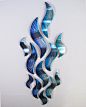 "Rip Tide" Large Metal Wall Sculpture - This abstract tropical wave sculpture transforms an ordinary wall space into a conversational centerpiece for your home or office! Very unique and a signature d