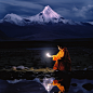 jintiantuimaoyoubianchangliao_man_on_rock_holding_a_torch_in_fr_65e7c17a-b6a4-4f76-b6f6-72cd894a7226