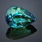 The beautiful color of a tropical ocean of this Kornerupine are probably related to the presence of chromium or vanadium. Because of the size, the color, and the clarity, this is the nicest Kornerupine we ever came across. This stone is step cut pear shap