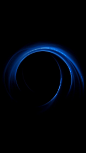 This may contain: an abstract blue ring in the dark