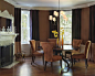 Traditional dark wood floor kitchen/dining room combo idea in Boston with brown walls, a tile fireplace and a standard fireplace