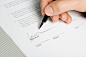 Royalty-free Image: hand signing a document