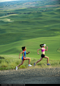 Women runners running in countryside - stock photo