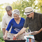 Photograph Friends grilling vegetables at backyard barbecue by Gable Denims on 500px