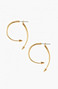 These gold arrow earrings give the illusion of a hoop. Simple enough to wear…
