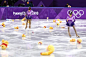 Kids collect plush toys of Winnie the Pooh after Japanese Yuzuru Hanyu's performance during the men's figure skating event at the 2018 Winter Olympic...