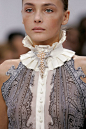 Description: Balenciaga at Paris Fashion Week Spring 2006. This collar is similar to the ruff/betsy style used in the Empire Period. It is not as large as the collars used then but still makes a statement.