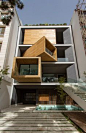 Rotating rooms give this Iranian house a shape-shifting facade.