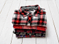 Stack of plaid shirts. Clothing concept.