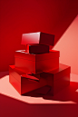 three open red gift boxes on a table on a red background, in the style of conceptual installation art, light-filled compositions, chromatic sculptural slabs, presentation of human form, flattering lighting, high-keyed palette, photo-realistic compositions