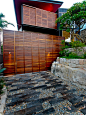 Inspiration for a medium sized contemporary driveway garden in Sydney with natural stone paving.