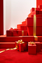 Gift boxes are sitting on red carpet with gold ribbon, in the style of pop-inspired installations, trompe l’oeil, minimalist abstracts, candid moments captured, happenings, red, xmaspunk