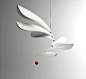 Sandro Lopez’s modern interpretation of the chandelier is at once a kinetic mobile sculpture and playful pendant. Its unique configuration of differently sized lamp shades counterbalance each other for different light and spacial arrangements. 3D printing