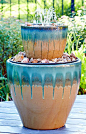 Listen to the soft burble of water spilling over rocks in this DIY fountain you can add to your deck or patio.: 