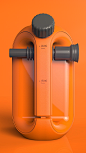 This may contain: an orange juicer with two black handles on it's side and the lid open