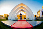 <p> At an on-site wedding chapel, a stage-like setup covered by three white arches, attendees can officially tie the knot....