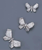 THREE ART DECO DIAMOND BUTTERFLY BROOCHES, BY BOUCHERON   Each butterfly of similar design and graduating size, with pavé-set diamond upper wings and baguette-cut diamond lower wings and body, circa 1935, 5.4, 3.9 and 3.3 cm. wide. Auctioned off by Christ
