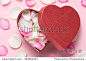 rose petals with hearts for Valentine's Day on board. Top view angle
