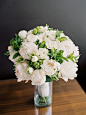 Simple and pretty white blooms with greenery for the bride's bouquet | http://www.weddingpartyapp.com/blog/2014/11/11/portland-loft-wedding-brittany-lauren-photography/: 