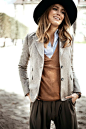 Grey tweed blazer, camel knit sweater, shirt, cool pants and relaxed, wavy hair.