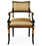 An Empire-style armchair with gilt and swept, scrolled arms.