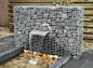 Gabion blade fountain by Gabion Schanskorven