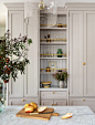 Light grey cabinetry + warm toned kitchen + open shelving + glassware shelving + marble countertop + glass semi-flush fixture | Heidi Caillier Design