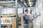 Businessmen using digital tablet in office by Gable Denims on 500px