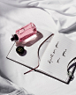 Photo by Louis Vuitton on September 13, 2023. May be an image of one or more people, makeup, fragrance, diary, flask, bottle, perfume, hand cream, water bottle and pen.