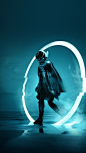 This may contain: a man in a space suit and helmet is standing in front of a circular object