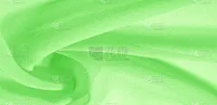 纹理背景模式。绿色真丝面料,带有淡淡的丝质光泽.它非常适合你的设计，口音，墙纸，海报和明信片.