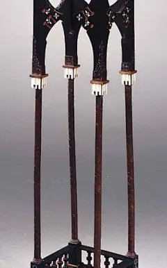CARLO BUGATTI Sellette, c. 1900, Ebonised wood and fruitwood, the square top raised on four slender columns on a square base, the whole decorated with geometrical and abstract motifs of pewter inlay, chased copper mounts and ivory applications, height 98c