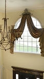 Arch window treatment - like it! Might be an idea for dressing up that balcony area in your foyer.: 