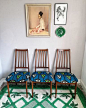 Set of 4 elegant vintage mid century teak dining chairs reupholstered in African fabric. 