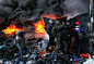 A pro-European integration protester throws stones towards riot police as others take cover in Kiev Jan. 23.