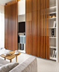 OMG! I am in love with this Slatted Wood and how it hides the entertainment center: 